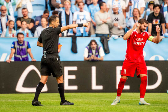 Gizo Mamageishvili of FC Iberia is shown a red card from