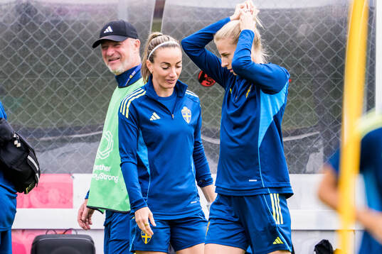 Head coach Peter Gerhardsson and Kosovare Asllani of the