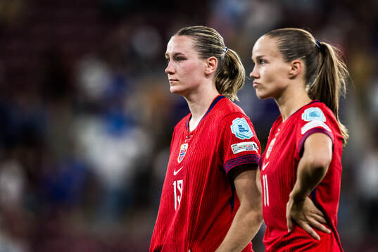 Elisabeth Terland and Guro Reiten of Norway looks dejected