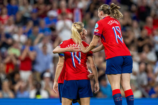 Ada Hegerberg of Norway celebrates with teammates Caroline