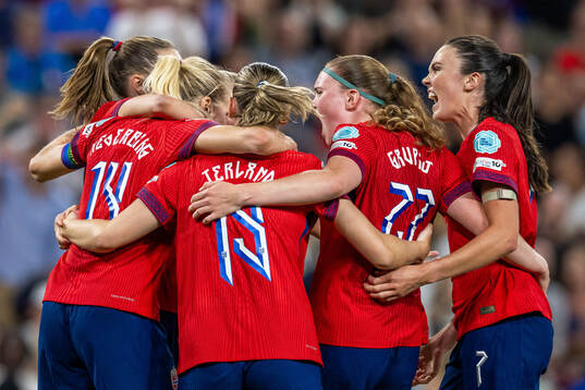 Ada Hegerberg of Norway celebrates with teammates Elisabeth