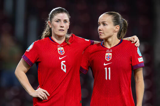 Maren Mjelde and Guro Reiten of Norway look dejected