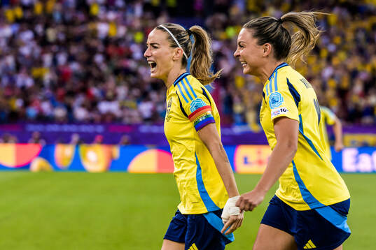 Kosovare Asllani and Johanna Rytting Kaneryd of Sweden