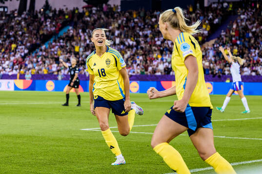 Fridolina Rolfö and Stina Blackstenius of Sweden celebrate