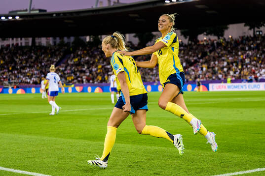 Fridolina Rolfö and Stina Blackstenius of Sweden celebrate