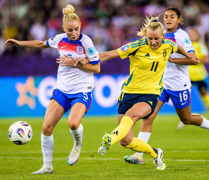Alex Greenwood of England and Stina Blackstenius of Sweden