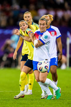 Kosovare Asllani of Sweden and Lucy Bronze of England