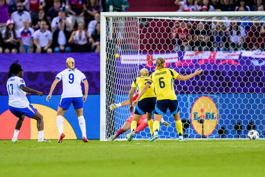 Michelle Agyemang of England scores the 2-2 goal behind