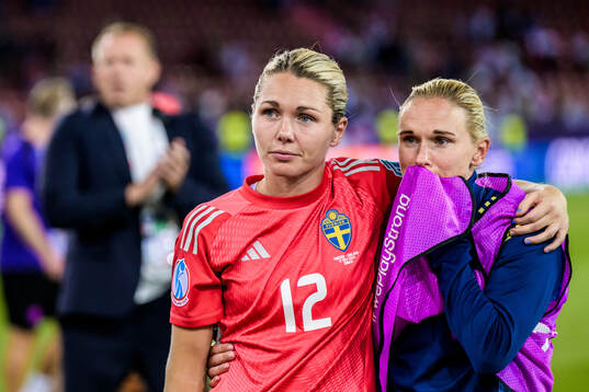 Goalkeeper Jennifer Falk and Jonna Andersson of Sweden look