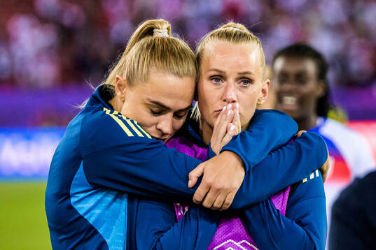 Fridolina Rolfö and Stina Blackstenius of Sweden look