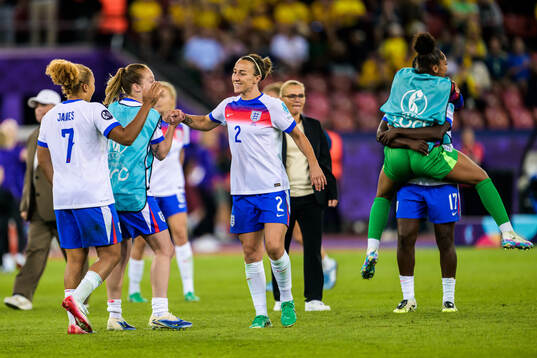 Lauren James and Lucy Bronze of England celebrate