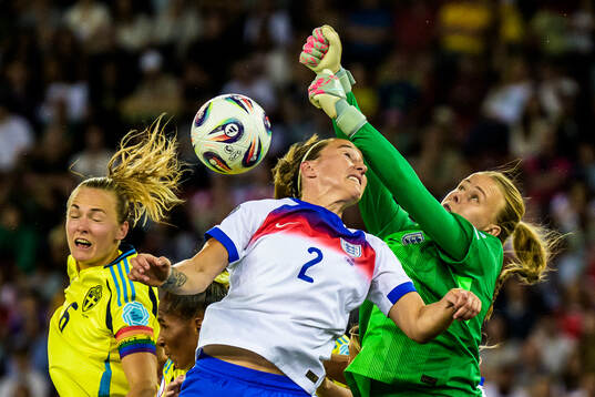 Magdalena Eriksson of Sweden and Lucy Bronze and goalkeeper
