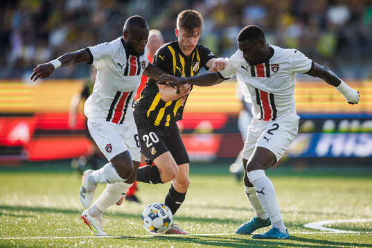 Cedric Badolo and Patrick Nwadike of Spartak Trnava against