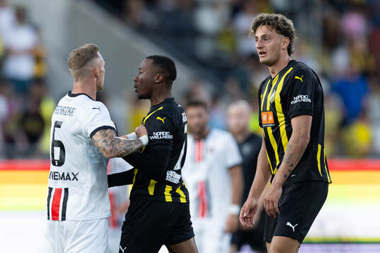 Roman Prochazka of Spartak Trnava and Silas Andersen and