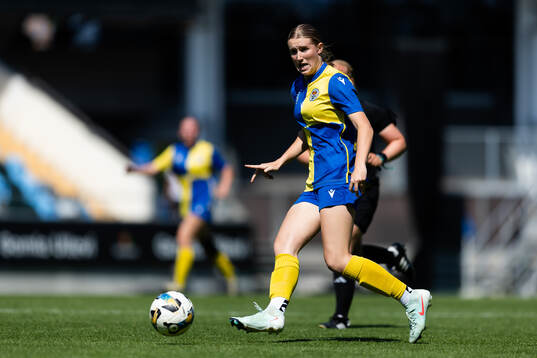 En Sydney spelare med bollen