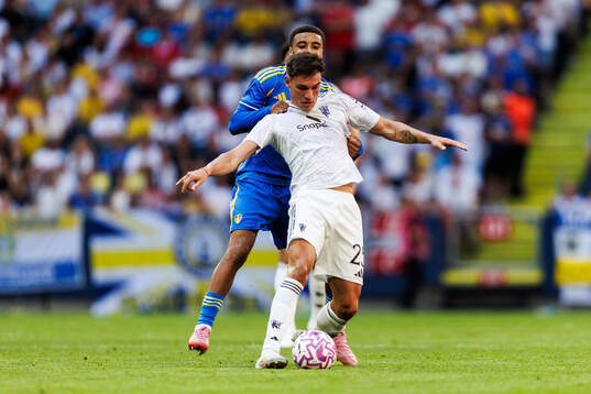 Jayden Bogle of Leeds United and Manuel Ugarte of