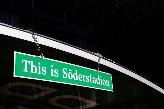 En skylt med texten This is Söderstadion hänger ovanför