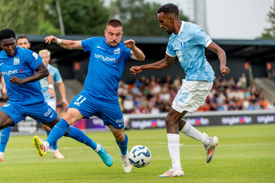 Roberts Savalnieks of FK RFS and Taha Ali of Malmö FF