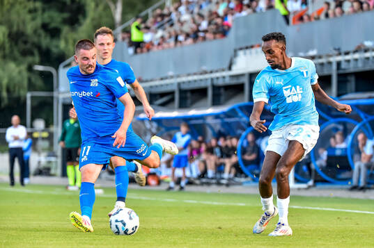 Roberts Savalnieks of FK RFS and Taha Ali of Malmö FF