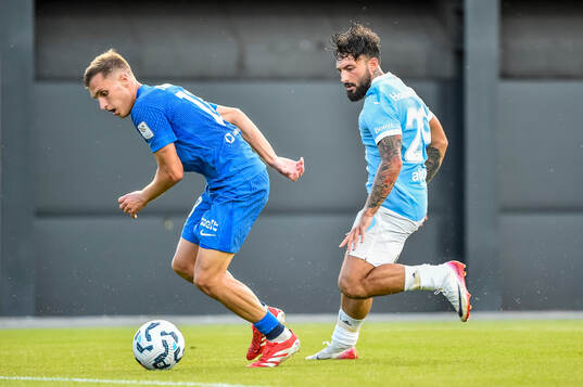 Dmitrijs Zelenkovs of FK RFS and Sead Haksabanovic of