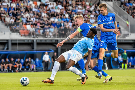 Emmanuel Ekong of Malmö FF and Ziga Lipuscek and Elvis