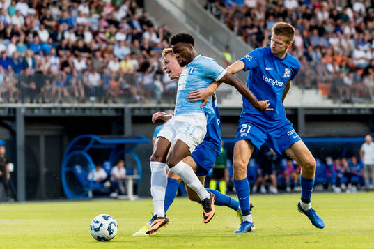 Emmanuel Ekong of Malmö FF and Ziga Lipuscek and Elvis