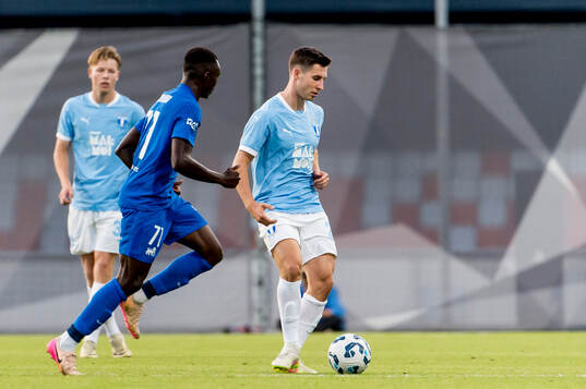 Lasse Berg Johnsen of Malmö FF and Barthelemy Diedhiou of