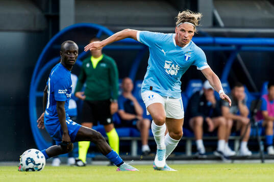 Jens Stryger Larsen of Malmö FF and Mor Talla of FK RFS