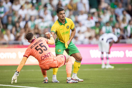 Jusef Erabi of Hammarby and goalkeeper Martin Delavallee of