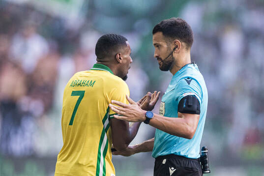 Paulos Abraham of Hammarby and referee Mathieu Vernice