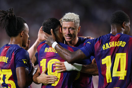Roony Bardghji and Robert Lewandowski of Barcelona
