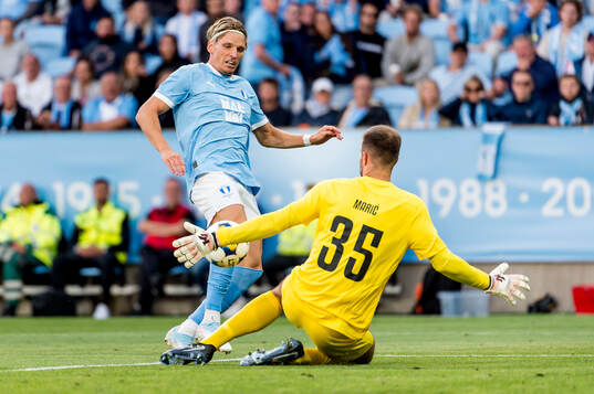 Jens Stryger Larsen of Malmö FF and goalkeeper Marko Maric
