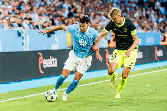 Colin Rösler of Malmö FF and Ziga Lipuscek of FK RFS