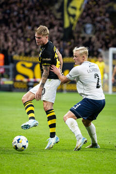 Erik Hovden Flataker of AIK against Michael Lilander of