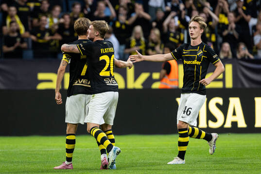 Anton Salétros of AIK celebrates with teammates