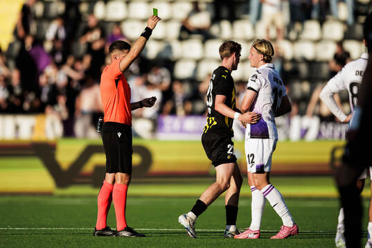 Kasper Dolberg of Anderlecht recieves a yellow card