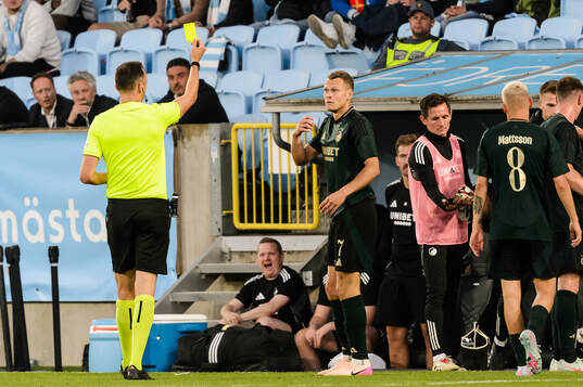 Viktor Claesson of FC Copenhagen receives a yellow card