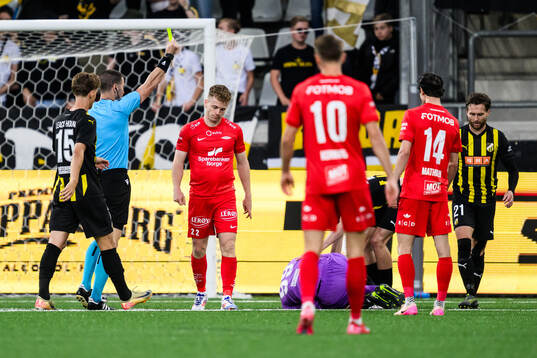 Saevar Atli Magnusson of Brann receives a yellow card