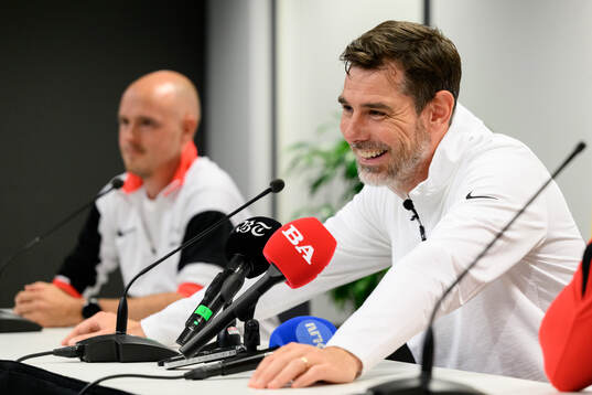 Coach Freyr Alexandersson at a press conference