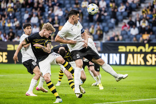 Erik Hovden Flataker of AIK and Paul Anton of Györi ETO
