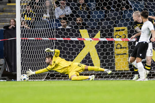 Milan Vitalis of Györi ETO scores 2-1 behind goalkeeper