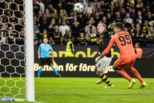 Johan Hove of AIK and goalkeeper Samuel Petras of Györi ETO