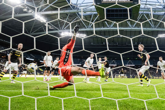 Goalkeeper Samuel Petras of Györi ETO and Johan Hove of AIK
