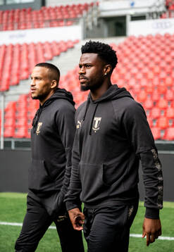 Martin Olsson and Emmanuel Ekong of Malmö FF at a stadium