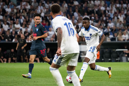 Adrian Skogmar of Malmö FF and Youssoufa Moukoko of FC