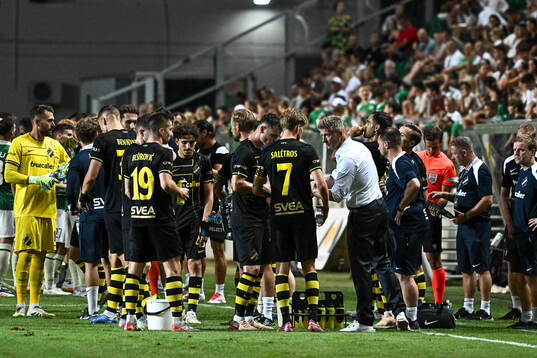 Players and coach Mikkjal Thomassen of AIK