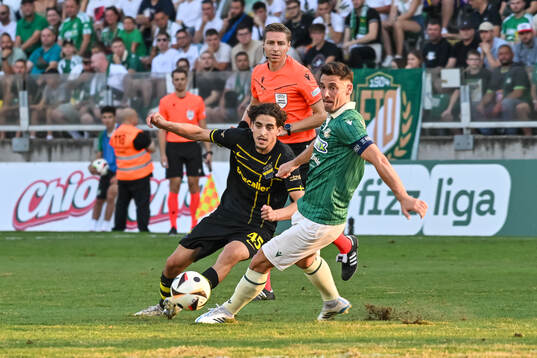 Taha Ayari of AIK and  Referee Lawrence Visser