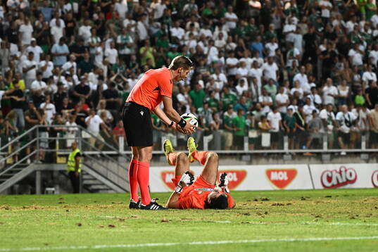 Referee Lawrence Visser and goalkeeper Samuel Petras of