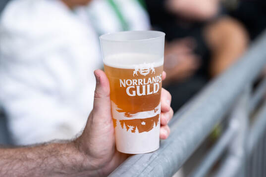 A beer in a plastic cup