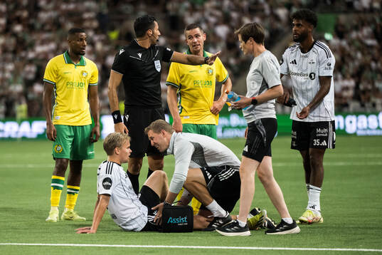 Santeri Väänänen of Rosenborg receives medical attention